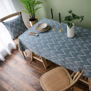 Navy blue geometric jacquard tablecloth with tassels and matching pillow for dining decor
