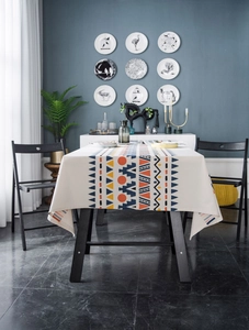 Detailed view of bohemian geometric pattern on a beige linen cotton rectangular tablecloth