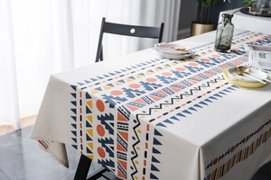 Detailed close-up of geometric bohemian print on beige table cloth fabric