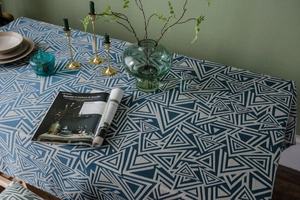 Close-up of geometric blue and white triangle pattern on thick cotton linen tablecloth