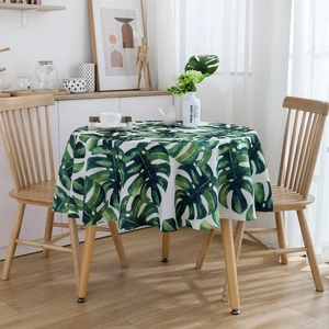 Waterproof round tablecloth with green monstera leaf print for modern dining decor