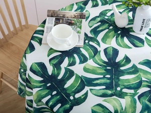 Close-up of tropical monstera leaf print on premium waterproof fabric tablecloth