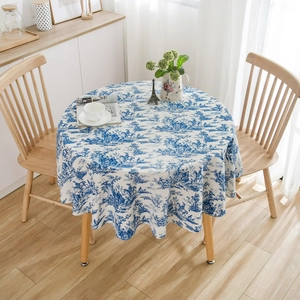 French blue and white Toile de Jouy floral pattern round tablecloth in a rustic setting