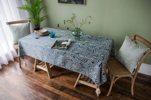 Detailed blue geometric tablecloth with cotton linen texture and white tassels decoration