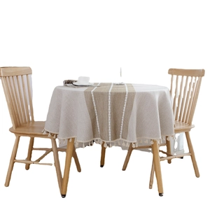 Minimalist cream linen round tablecloth with brown stripe and decorative tassel fringe