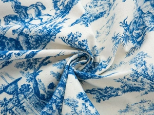 Detailed view of blue Toile de Jouy pattern on soft cotton linen fabric textures