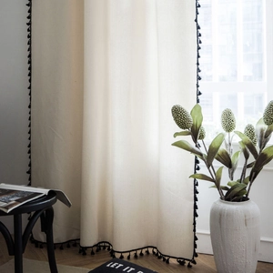 Minimalist beige textured linen curtain with black tassel edges for home decor