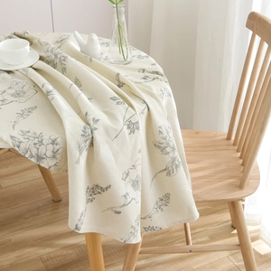 Beige round cotton linen tablecloth with elegant floral prints for dining room decor