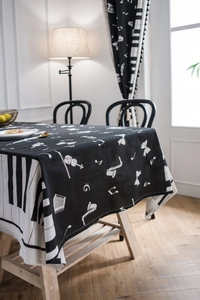 Close-up of piano keys and musical notes pattern on premium cotton linen tablecloth