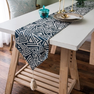 Nordic navy blue jacquard table runner with geometric triangles and white tassels