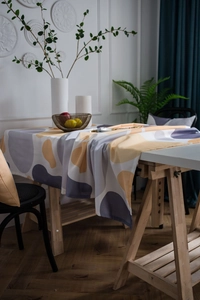 Detailed texture of geometric pattern tablecloth with gray and yellow abstract blocks