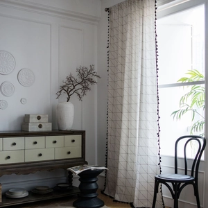 Cream cotton linen curtain with black geometric grid and pom-pom trim for windows