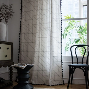 Beige cotton linen curtain with black geometric grid and tassel fringe in Nordic style
