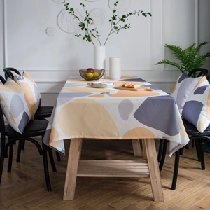 Minimalist rectangular tablecloth with abstract pebble pattern in yellow and grey colors