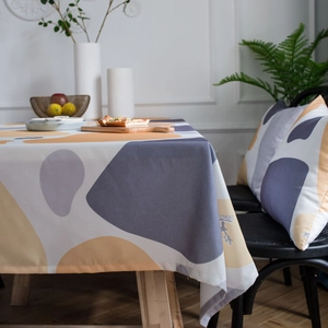 Rectangular pebble print tablecloth with abstract yellow and blue geometric Nordic patterns