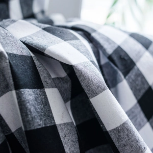 Classic black and white buffalo plaid cotton curtain with rustic tassel detailing