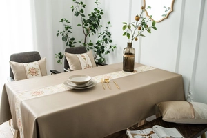 Detailed embroidery of pink roses on a premium beige rectangular tablecloth set