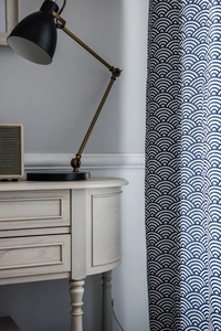 Detailed close-up of navy blue Japanese wave pattern curtain with cotton linen texture