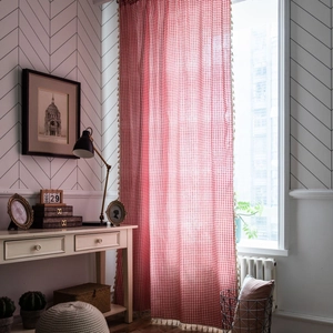 Red and white gingham window curtain with tassel trim for a rustic kitchen home decor