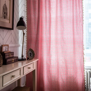 Red and white gingham curtains with cream tassel trim for cozy home window decor