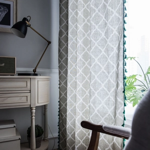 Grey American style cotton linen curtains with green pom-pom trim and geometric print