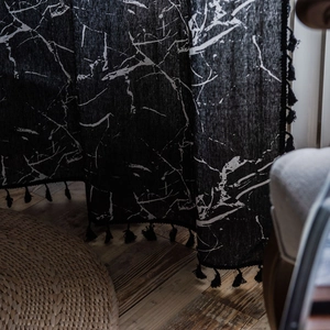 Modern black and white marble print curtain with elegant black tassels and linen texture