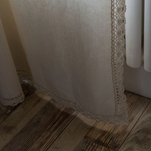 Beige linen curtain with elegant crochet lace trim in a rustic Japanese style home decor