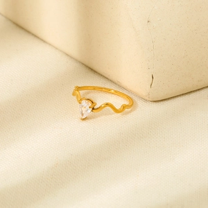 Minimalist 18K gold plated wavy ring featuring a pear-shaped cubic zirconia stone