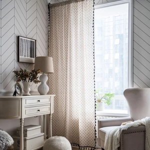 Off-white daisy print semi-sheer cotton linen curtain with black tassel fringe trim