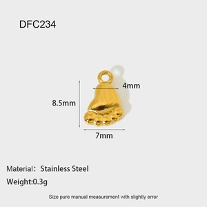 Detailed macro view of 8.5x7mm gold footprint charm in stainless steel for DIY jewelry