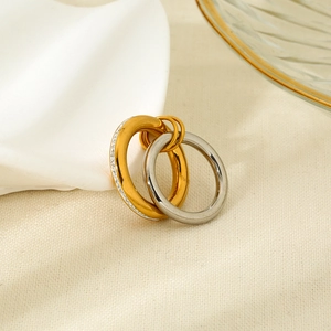 Interlocked gold and silver stainless steel earrings with sparkling white zirconia stones