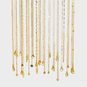 Various styles of gold-plated stainless steel chains including snake and link textures