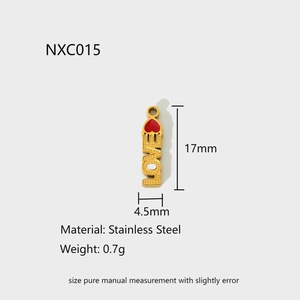Macro detail of 17mm gold stainless steel bar pendant with red heart and LOVE engraving