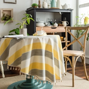 Nordic round tablecloth with yellow and grey stripes and elegant fringe tassels