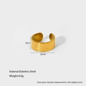 Detailed macro view of 18K gold-plated stainless steel leaf ring with hammered texture