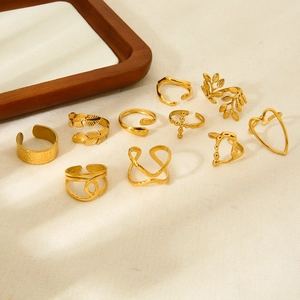 Set of 18K gold plated stainless steel open rings with leaf and heart designs for women.