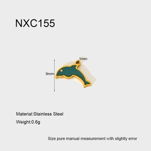Macro detail of mermaid enamel charm in green and gold with specific size measurements
