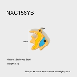 Detail view of a 16mm gold stainless steel fish pendant with yellow and blue enamel inlay