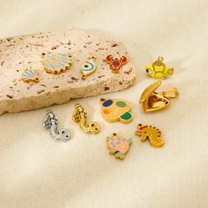 Colorful enamel ocean charms including mermaid and shell pendants for DIY jewelry making