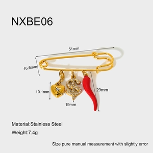 Detail view of 18K gold plated stainless steel pin brooch with heart and dollar pendants