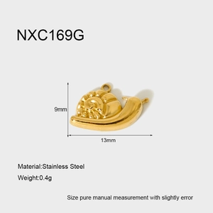 Macro detail of 18K gold-plated stainless steel snail pendant with 13x9mm dimensions