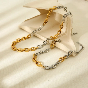 Two-tone gold and silver stainless steel chunky chain bracelet with textured diamond-cut links