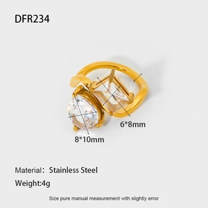 Detail view of 18K gold plated stainless steel ring with pear and rectangle stones