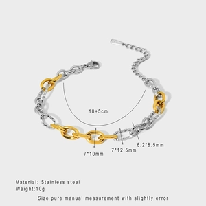 Detail view of mixed silver and gold plated stainless steel chain bracelet with lobster clasp