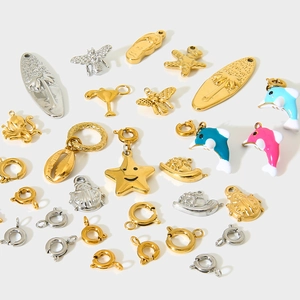 Assorted 18K gold plated stainless steel pendants including dolphin and starfish charms