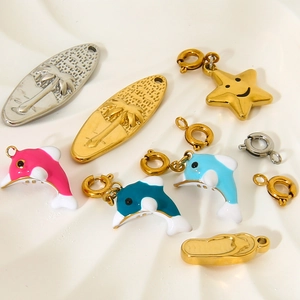 18K gold plated marine charms set with enamel dolphins, coconut trees, and stars