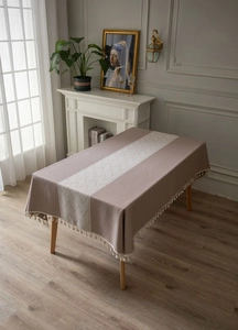 Detailed view of rectangle tablecloth with fringe edges and geometric woven patterns