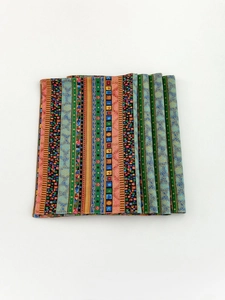 Detail of bohemian striped placemat fabric showing intricate geometric and floral patterns