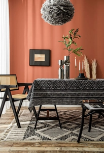 Detailed view of geometric black and white tribal pattern on thick linen tablecloth
