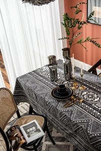 Detail view of cotton linen tablecloth featuring bohemian geometric triangle print